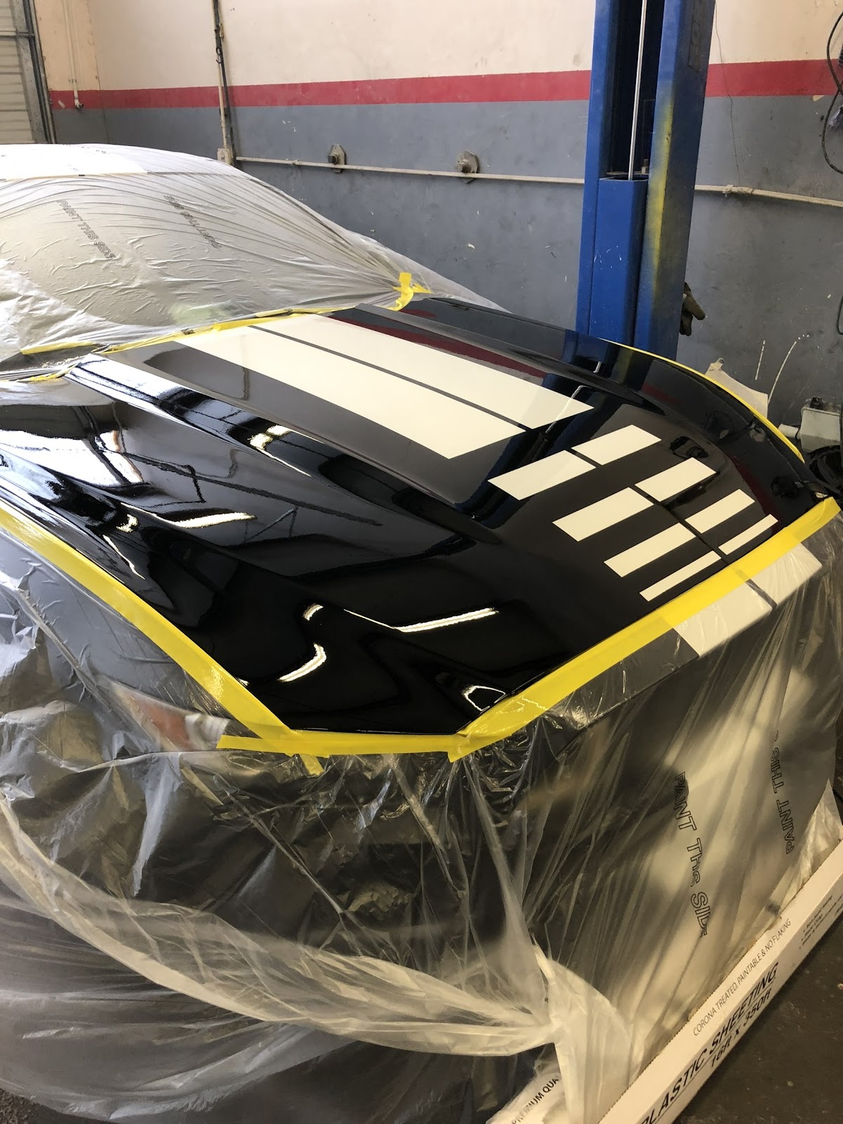 Finished glossy racing stripe hood after paint and clear coat