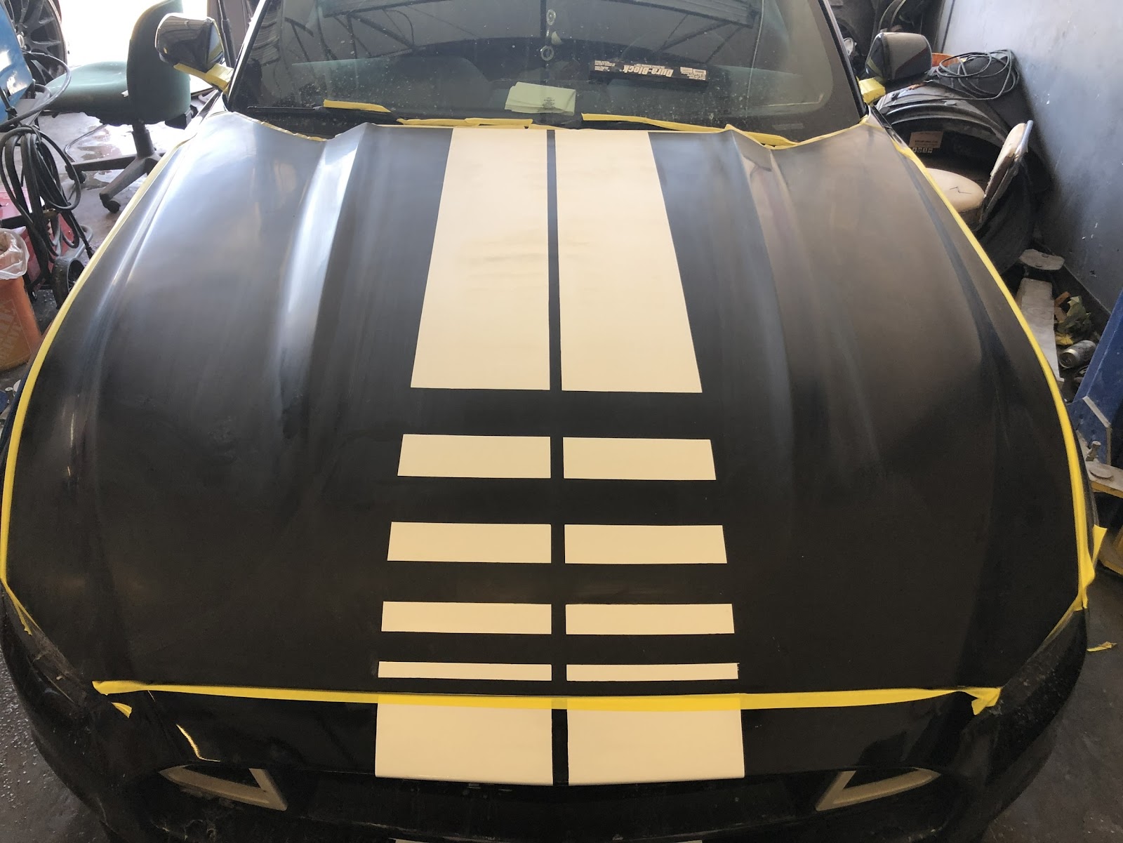 Mustang hood masked and taped before racing stripe paint